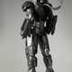 Illustration for article titled How Does War Machines Gun Work? Can He Sit Down? New Toy Pics Reveal All!